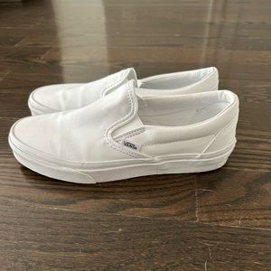 Vans canvas slip ons in white.